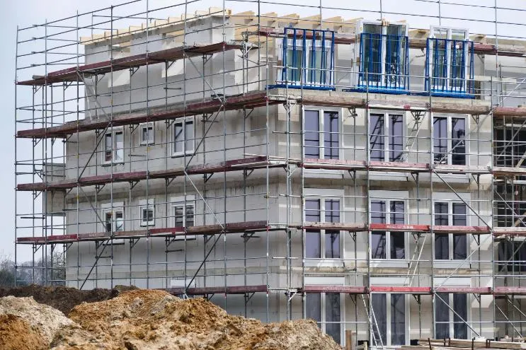 Windows being fitted in a building under construction